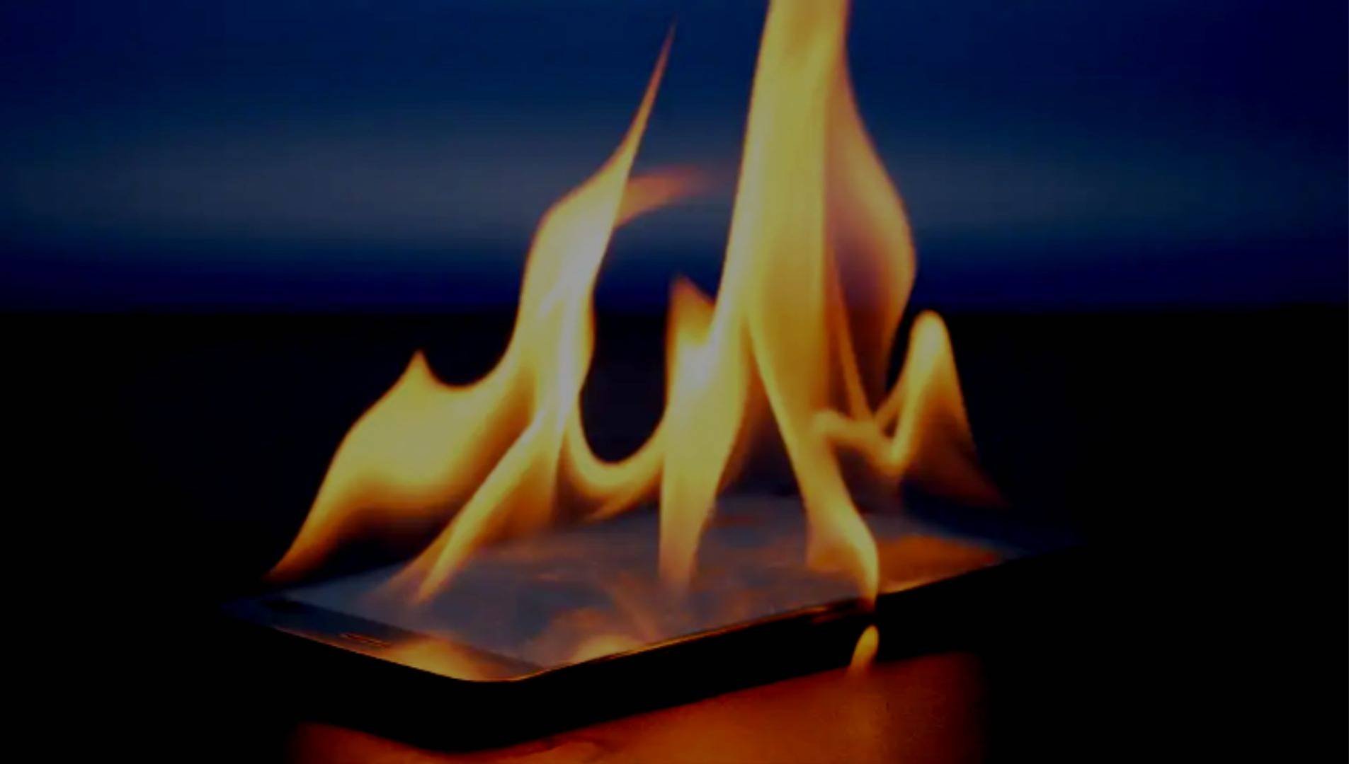 A photo of a phone on fire.