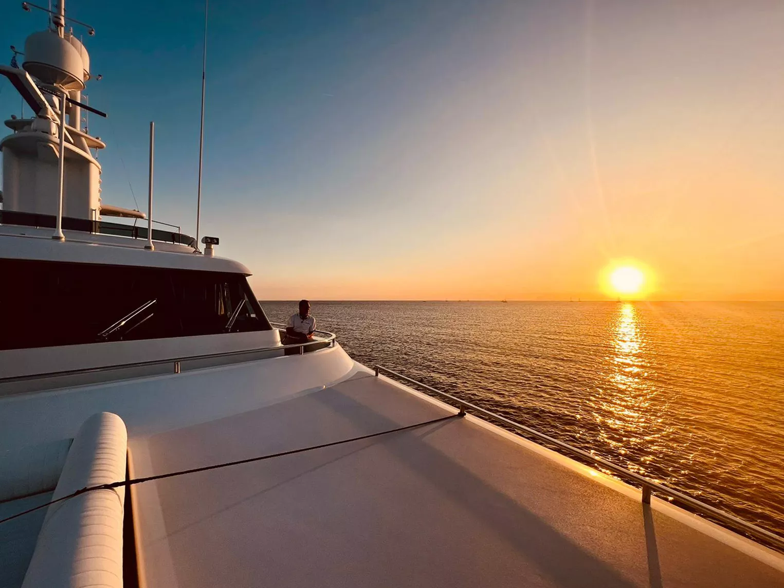 Photo of the sunset on the sea from a superyacht.