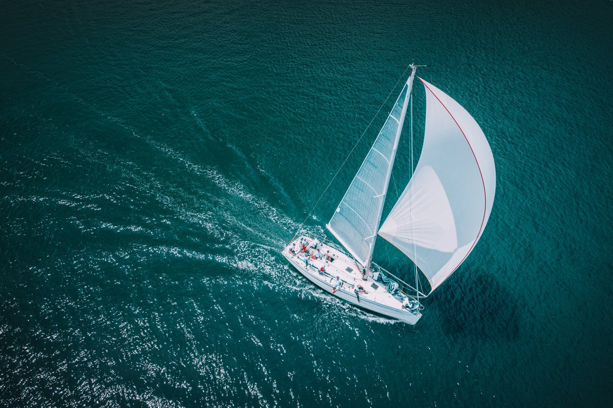 A photo of a sailing boat in the sea.