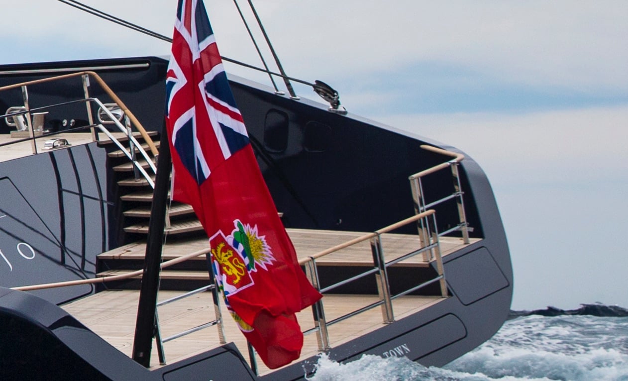 photo of a flag on a yacht.