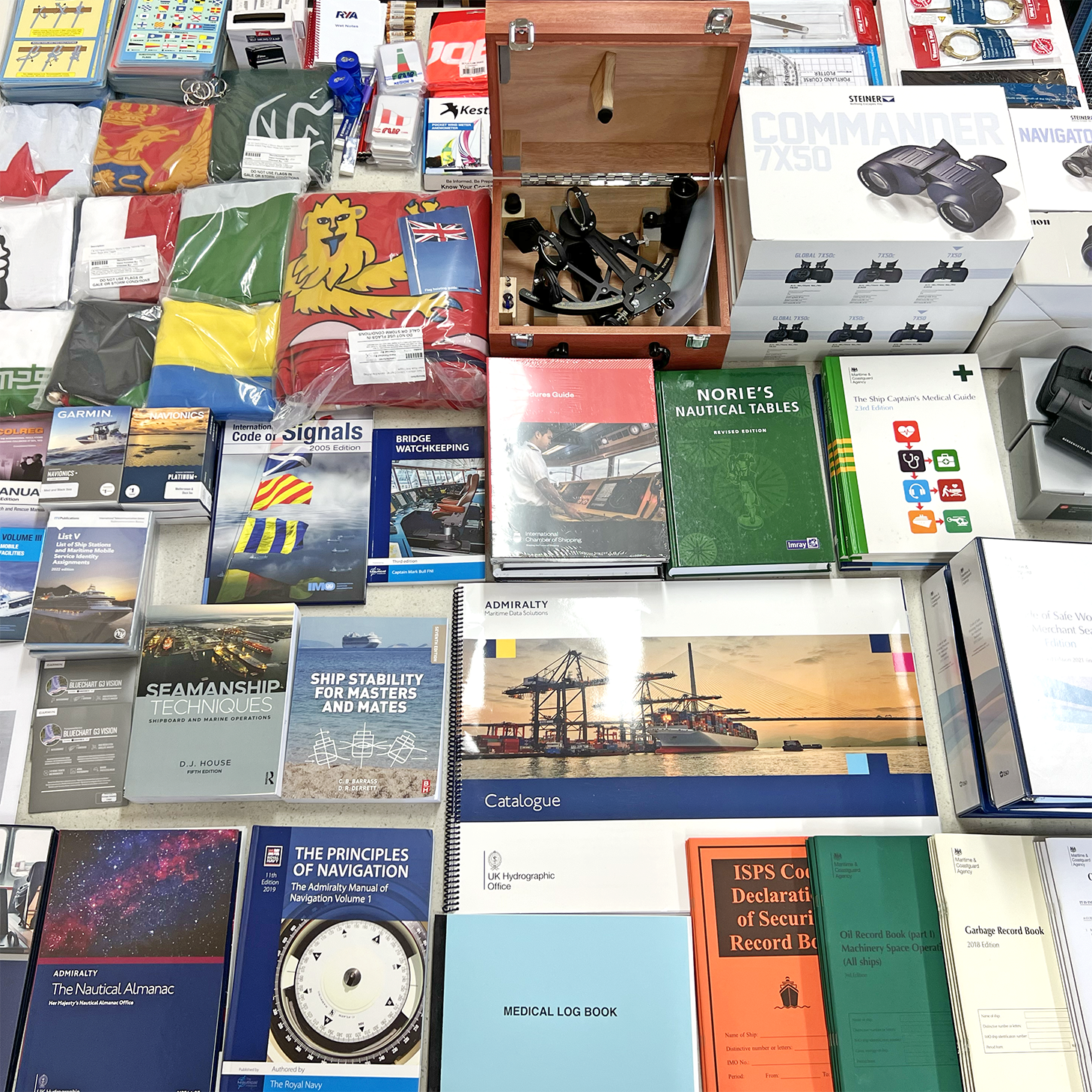 A table full of publications and navigation equipment for superyachts